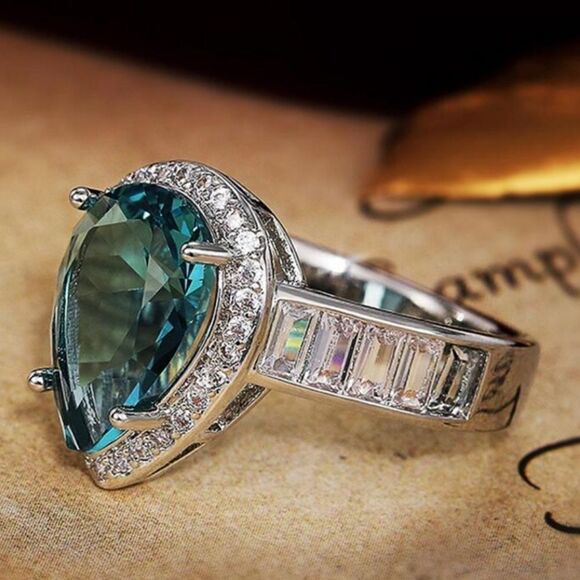 Pear Cut Blue Sapphire Flanked By White Baguette Diamonds on 925 Sterling Silver - Picture 6 of 8